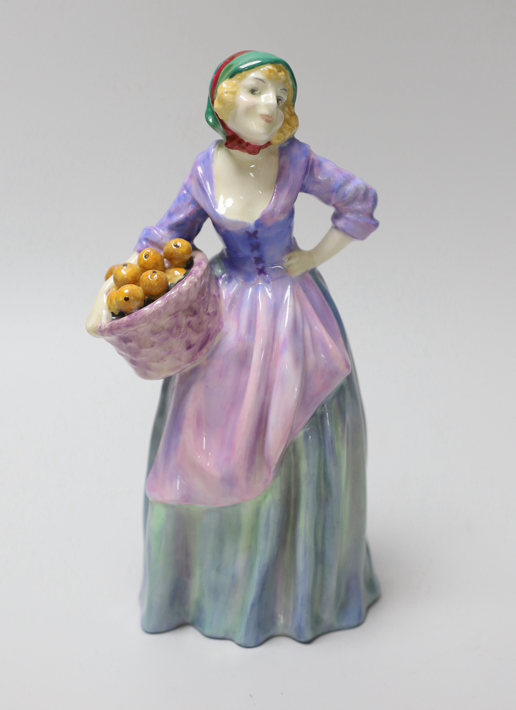 A Royal Doulton figure 'The Orange Seller, HN1325, inscribed to the base 18.5cm high